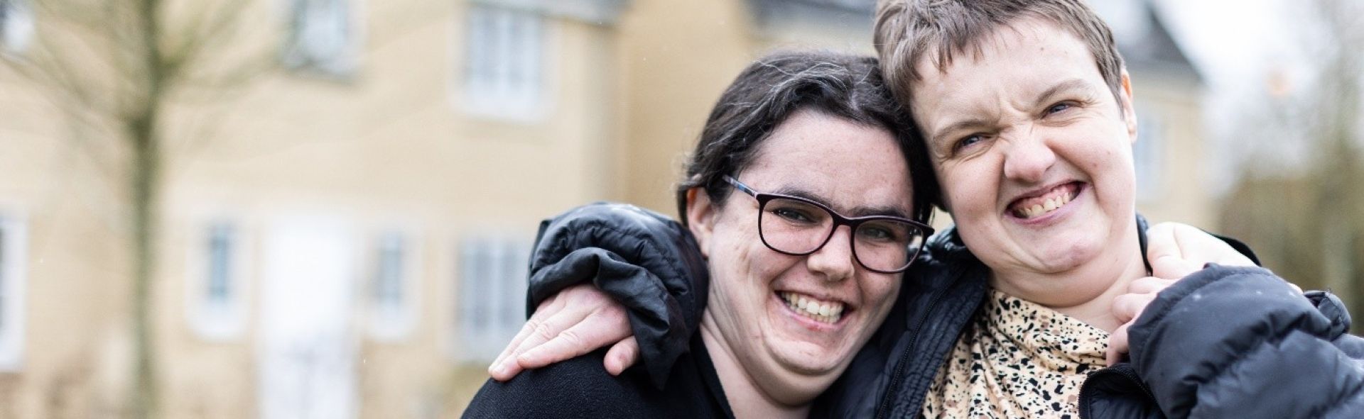 Two women stood outside a residential house