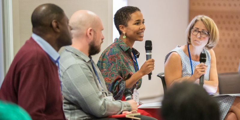 Person speaking with microphone