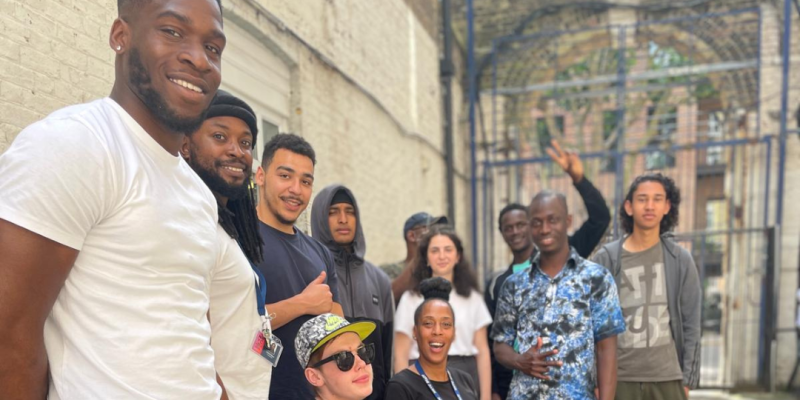 A group of people smiling outside