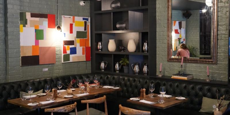  The image shows a cosy fine-dining restaurant