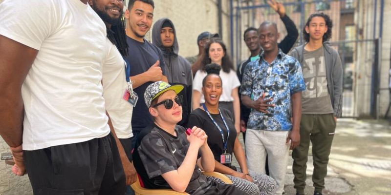 A group of people smiling outside
